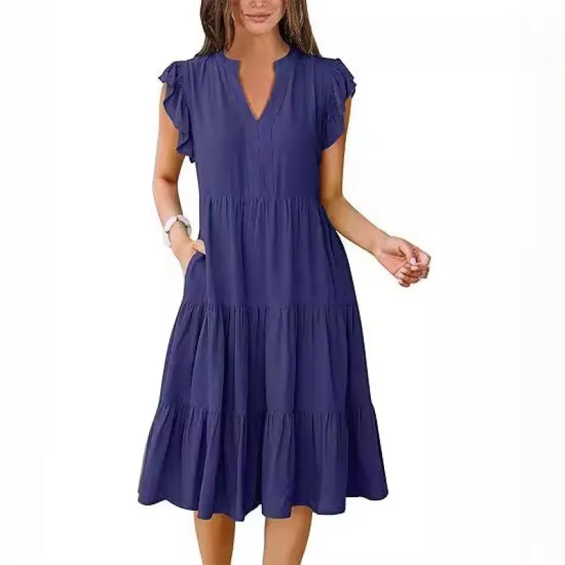 Elegant flowy women's V-neck midi dress featuring a beautiful tiered skirt and soft flutter sleeves.