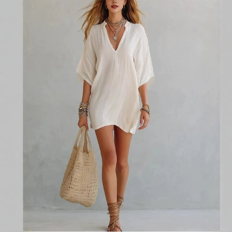 Comfortable women's relaxed fit V-neck tunic dress. Ideal for casual wear, beach, or warm weather.
