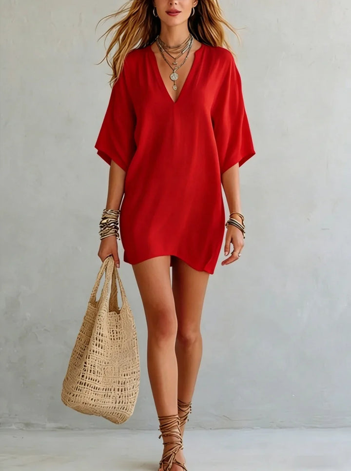 Trendy V-neck tunic mini dress for women. Oversized, relaxed fit; a must-have for summer fashion & vacations.