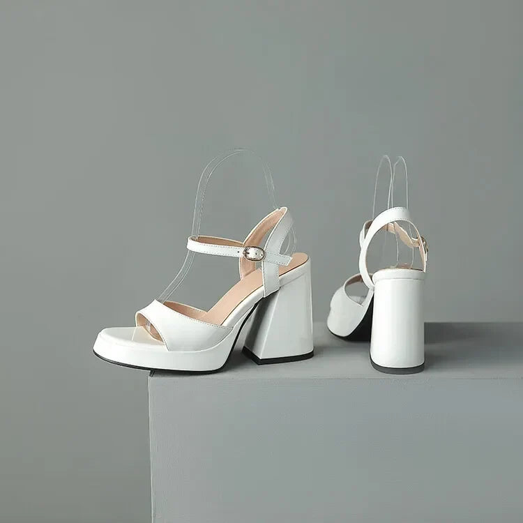 Sleek Valetta Gloss Block Heels, luxurious high-shine finish on elegant women's footwear for formal style.