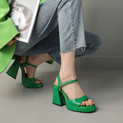 Side view of Valetta Gloss Block Heels, showcasing a sturdy block heel, glossy finish & ankle strap detail.