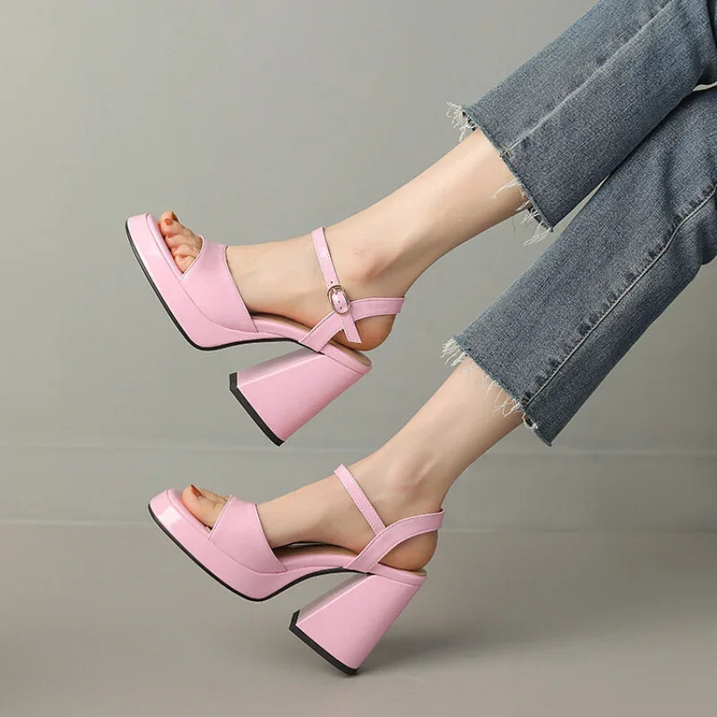 Close-up of Valetta Gloss Block Heels, emphasizing the chic ankle strap and luxurious glossy texture.