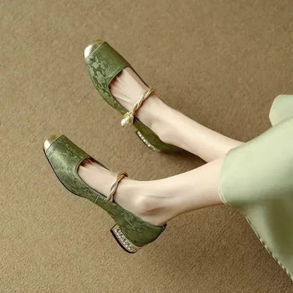 Side profile of Valoria women's elegant studded pumps, showcasing the chic square toe & stylish heel.