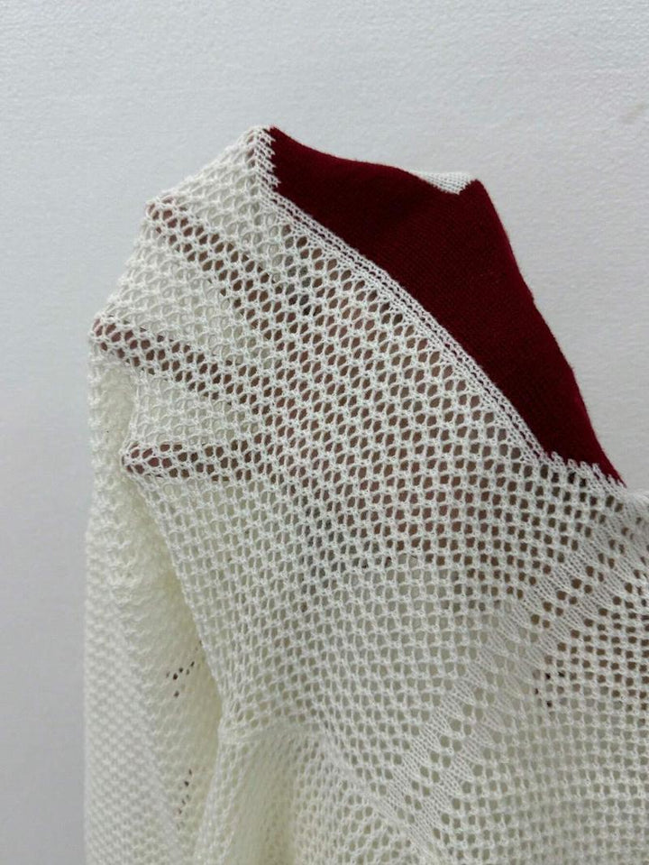 Relaxed oversized women's varsity sweater, stylish and comfortable long-sleeve design for everyday chic.