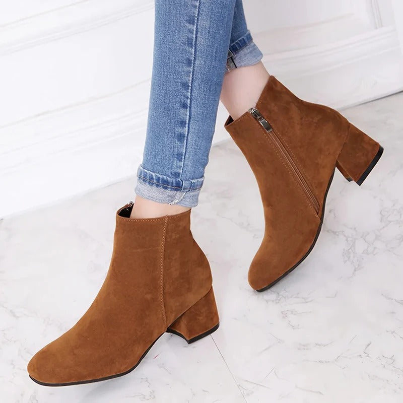 Women's versatile ankle boots with sturdy block heel & convenient side zip for everyday casual comfort.