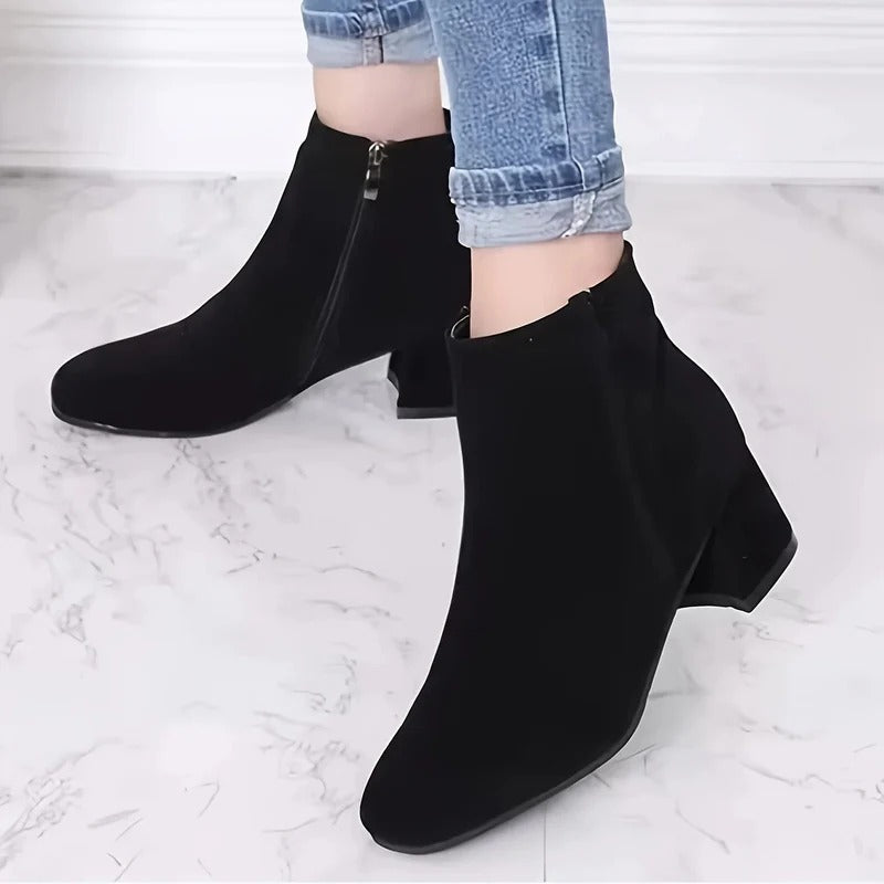 Comfortable women's ankle boots featuring a stylish block heel & practical side zip closure.