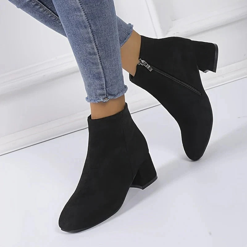 Versatile women's ankle boots with a chic block heel & easy side zip for all-day wear.