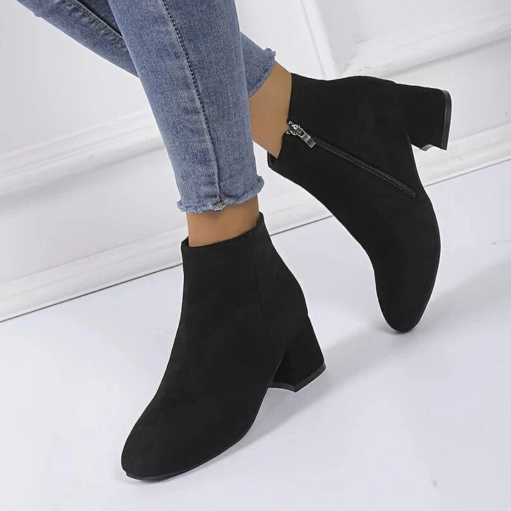 Versatile women's ankle boots with a chic block heel & easy side zip for all-day wear.
