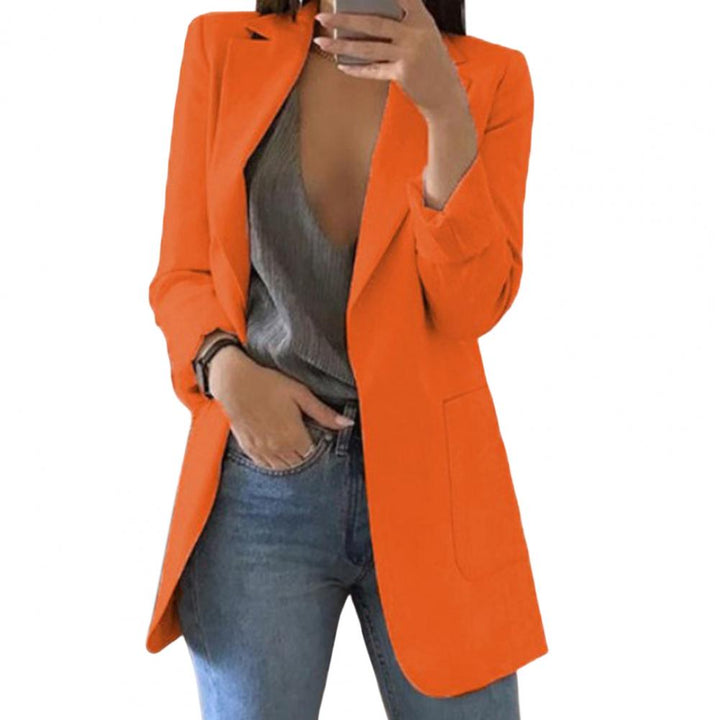 Chic women's versatile blazer for spring/fall fashion, with large pockets, ideal for a layered everyday look.