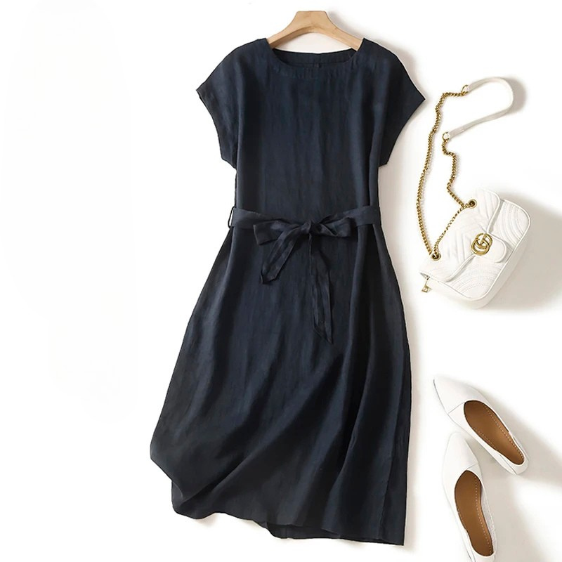 Elegant women's flowing midi dress with a comfortable cinched waist, ideal for everyday summer fashion.