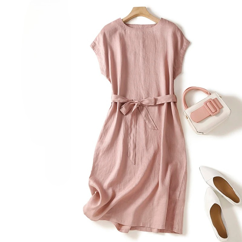 Comfortable women's flowing midi dress with a cinched waist, perfect for versatile summer wear.