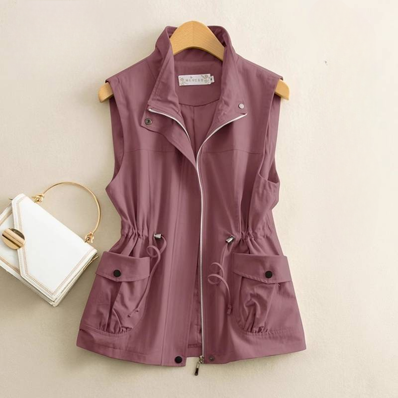 Durable cotton canvas vest for women, a versatile layering piece in a classic outerwear style.
