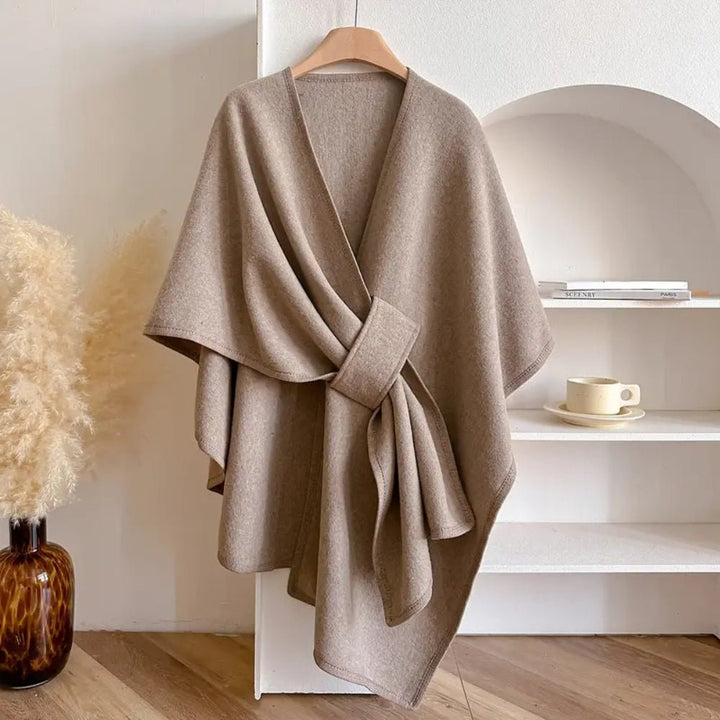 Women's versatile poncho scarf coat for all seasons. Elegant fashion wrap for cozy layering.