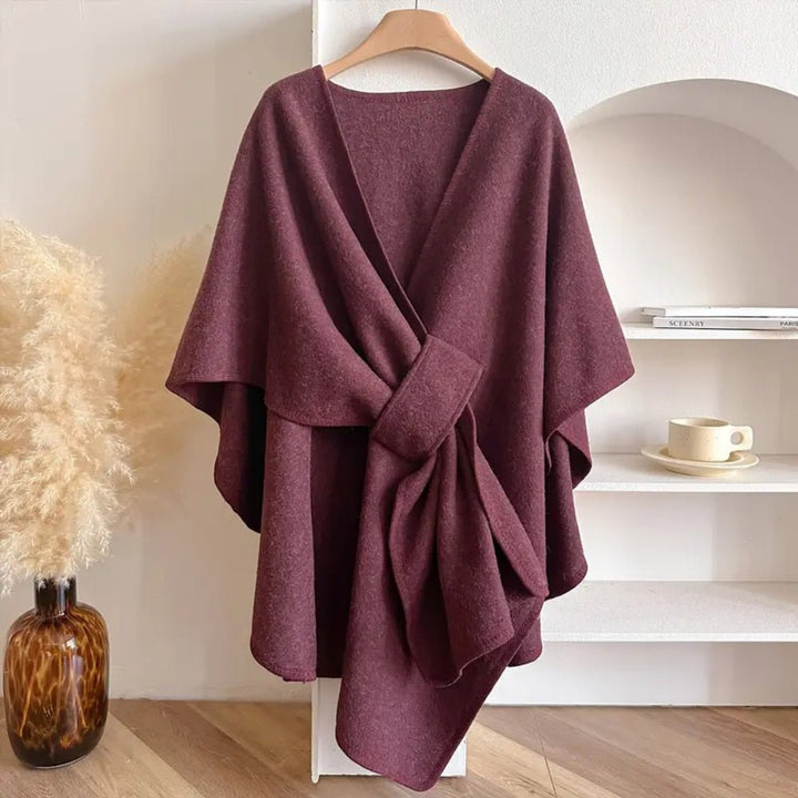 Cozy women's fashion poncho, an elegant wrap for versatile layering and outerwear.