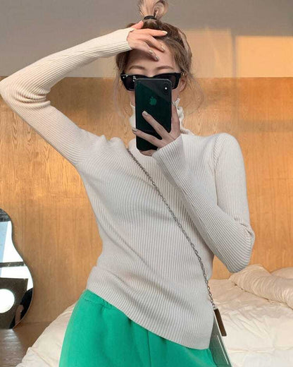 Warm women's long sleeve pullover, a chic turtleneck sweater ideal for winter layering.