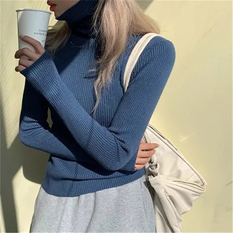 Warm women's turtleneck sweater, an essential long sleeve pullover for chic winter fashion.