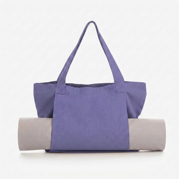 Stylish women's canvas yoga mat tote bag. Perfect for fitness, gym, and daily essentials. Versatile shoulder carry.