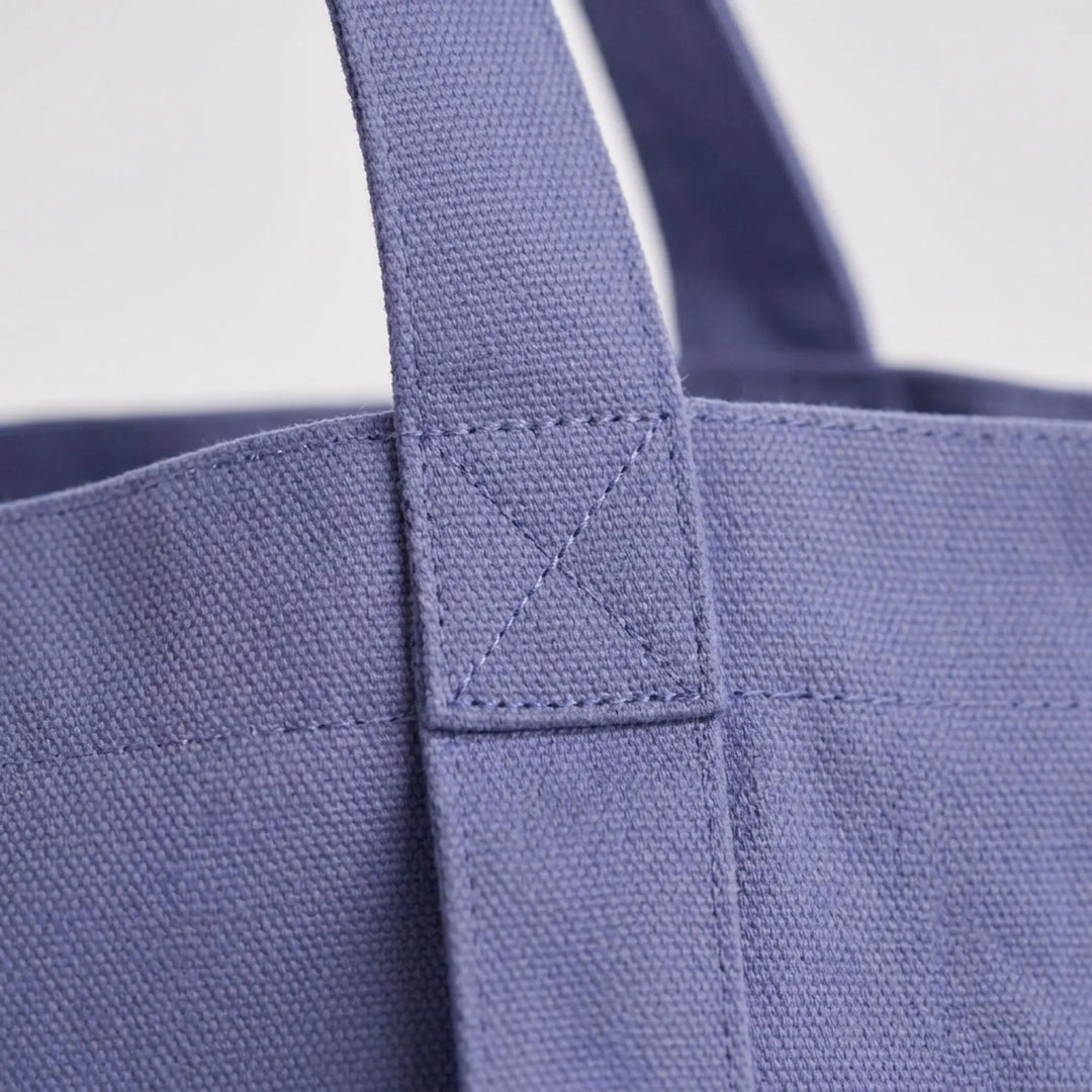 Durable canvas yoga mat bag for women. Spacious tote for gym, workout, and everyday use. Comfortable shoulder strap.