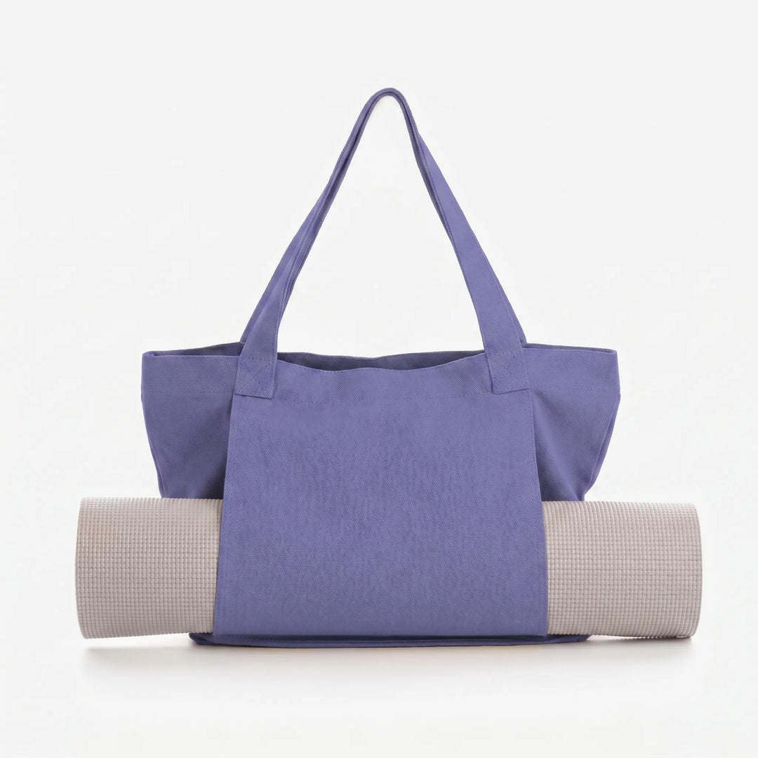 Multi-functional women's yoga tote. Securely holds mat & accessories. Great as a fitness, gym, or everyday shoulder bag.
