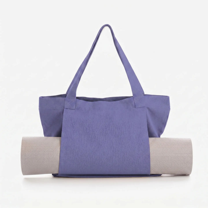 Multi-functional women's yoga tote. Securely holds mat & accessories. Great as a fitness, gym, or everyday shoulder bag.