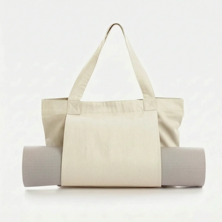 Women's practical yoga mat tote bag. Durable canvas workout bag, ideal for gym, fitness, and daily use. Easy shoulder carry.