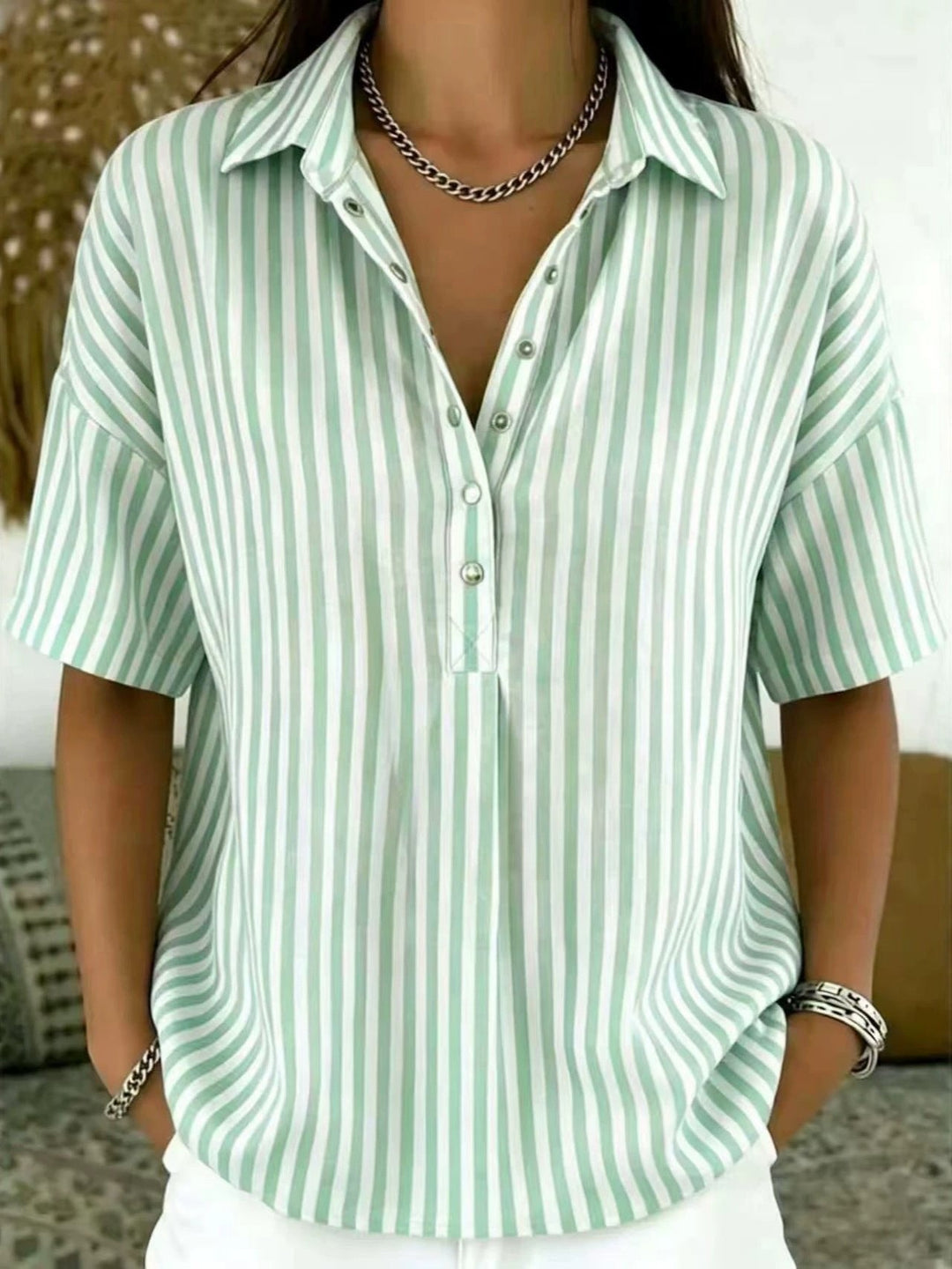 Women's vertical stripe half-button blouse, short sleeve, relaxed fit. Perfect for spring/summer casual elegance.