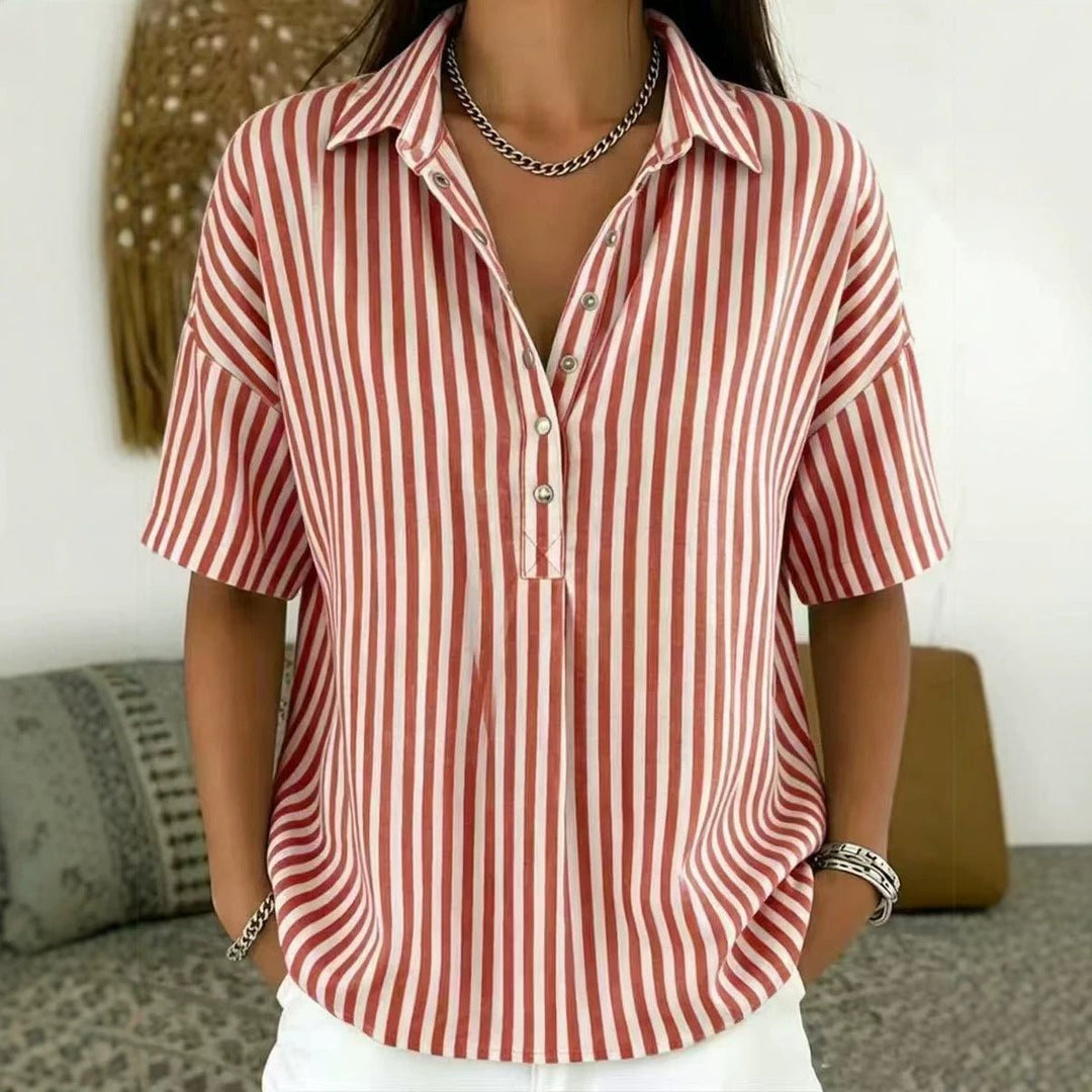 Women's short sleeve vertical stripe blouse with half-button closure, comfortable relaxed fit. Casual spring top.