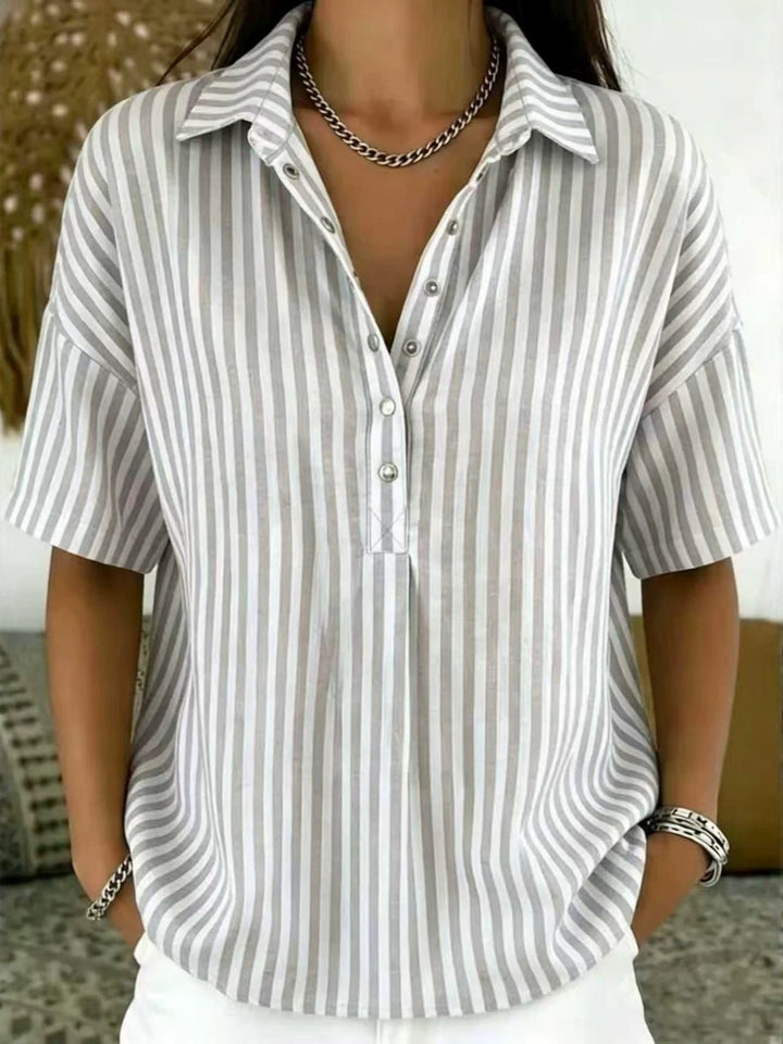 Casual women's striped short sleeve blouse, vertical pattern, half-button. Versatile spring summer fashion top.
