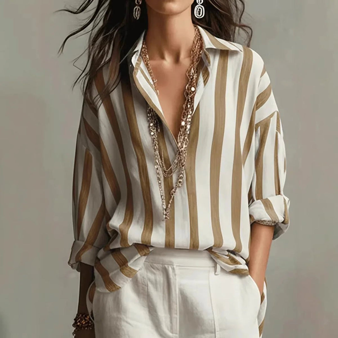 Stylish women's vertical stripe blouse with open collar, long sleeves. Elegant, versatile top for casual or professional wear.