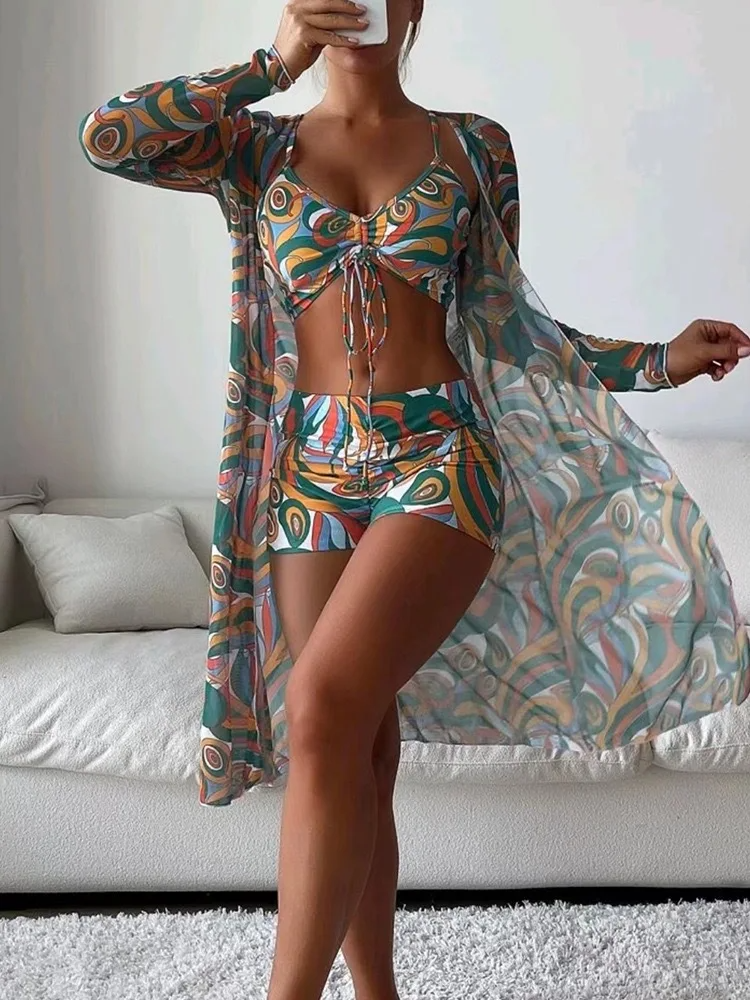 Comfortable and stretchy women's 3-piece swim set featuring a vibrant print.