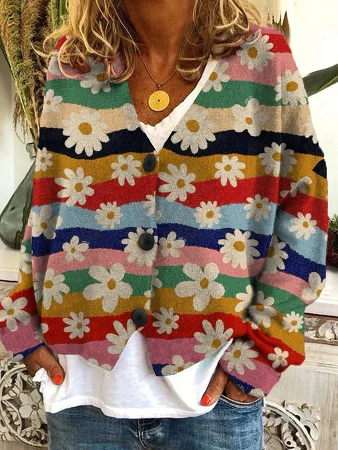 Stylish women's cardigan featuring a bold floral print and classic stripe pattern. Effortless style.