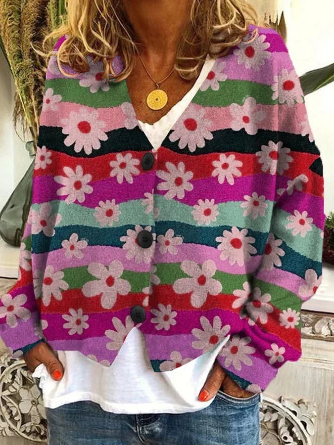 Casual women's button-up cardigan with vibrant floral and stripe design. A chic layering piece.