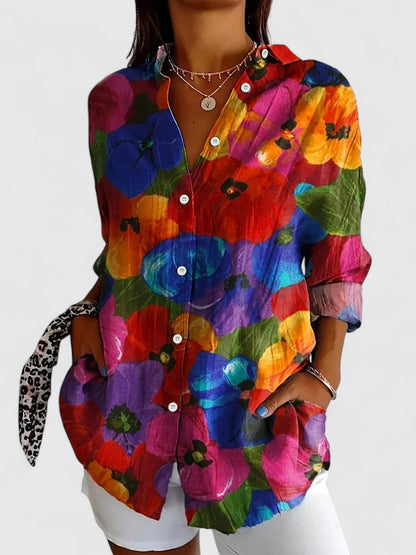 Stylish women's summer blouse featuring a vibrant print, great for vacation outfits and warm weather.