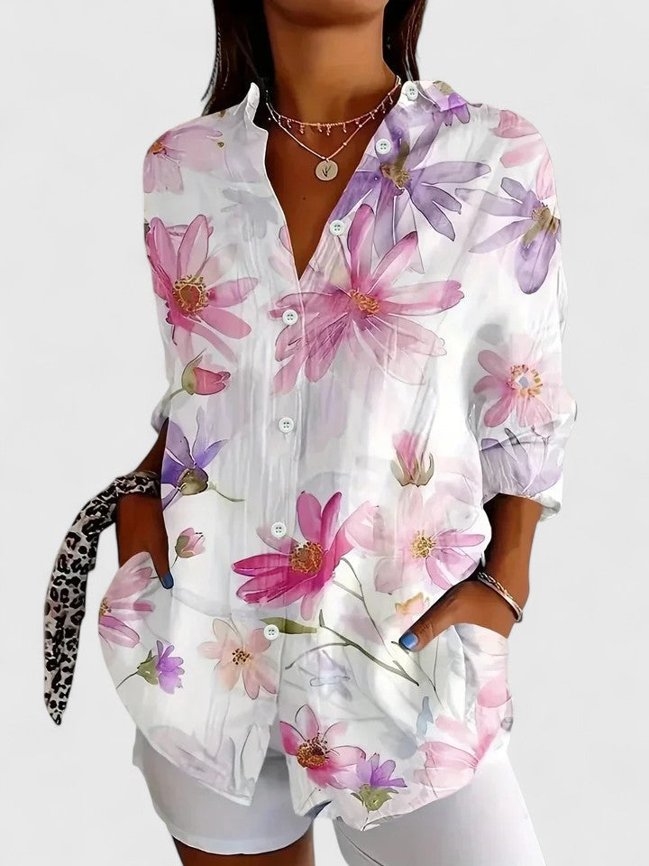 Fashionable women's blouse with a vibrant, eye-catching print, perfect for adding a pop of color to any outfit.