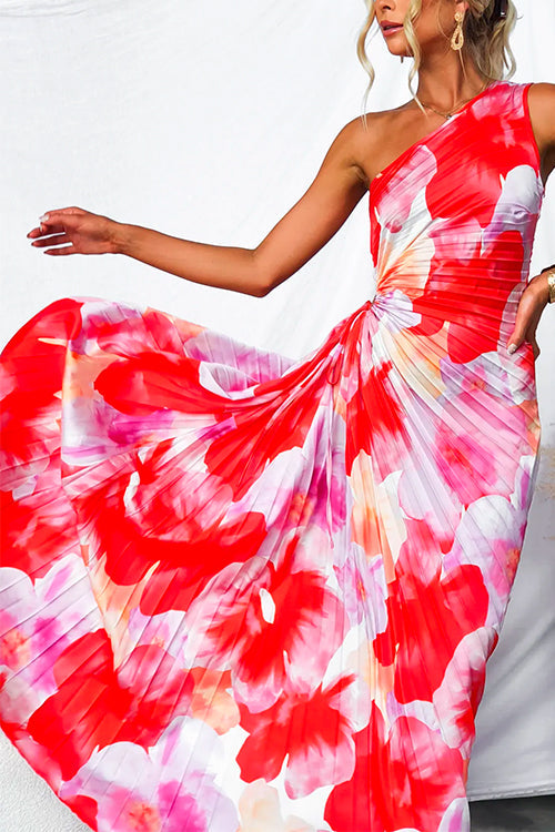 Women's vibrant one-shoulder evening gown with an eye-catching print and elegant pleated skirt. Perfect party dress.