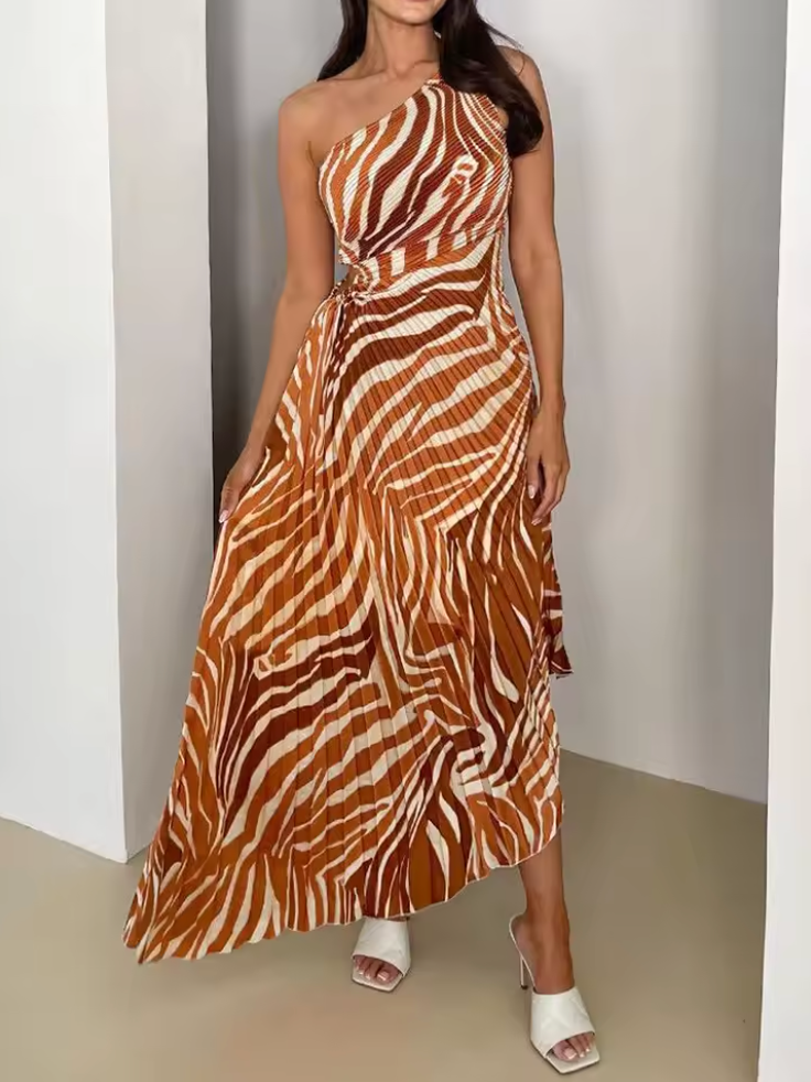 Stylish women's wedding guest gown with a vibrant print and trendy one-shoulder asymmetric cut. Formal and elegant.