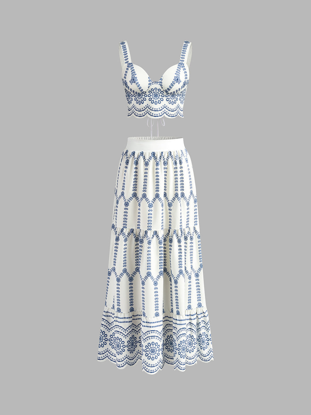 Women's vibrant printed sleeveless tie back crop top and matching mini skirt set, perfect for summer vacation fashion.