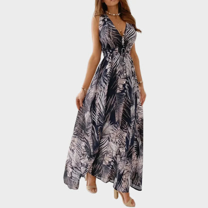 Elegant women's sleeveless V-neck maxi dress with vibrant tropical floral print. Ideal beach or summer vacation dress.