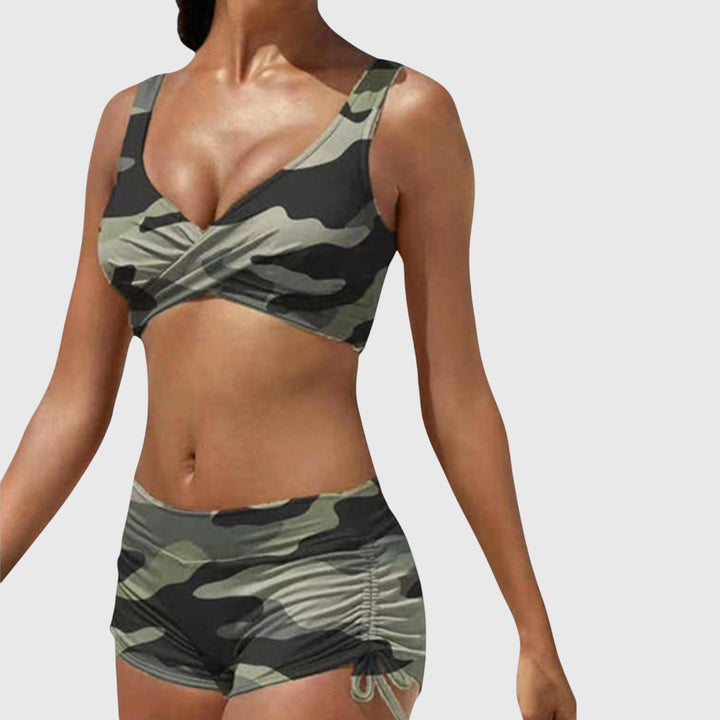 Women's vibrant two-piece bikini swimsuit, perfect for stylish summer beachwear & poolside fashion. Comfortable fit.