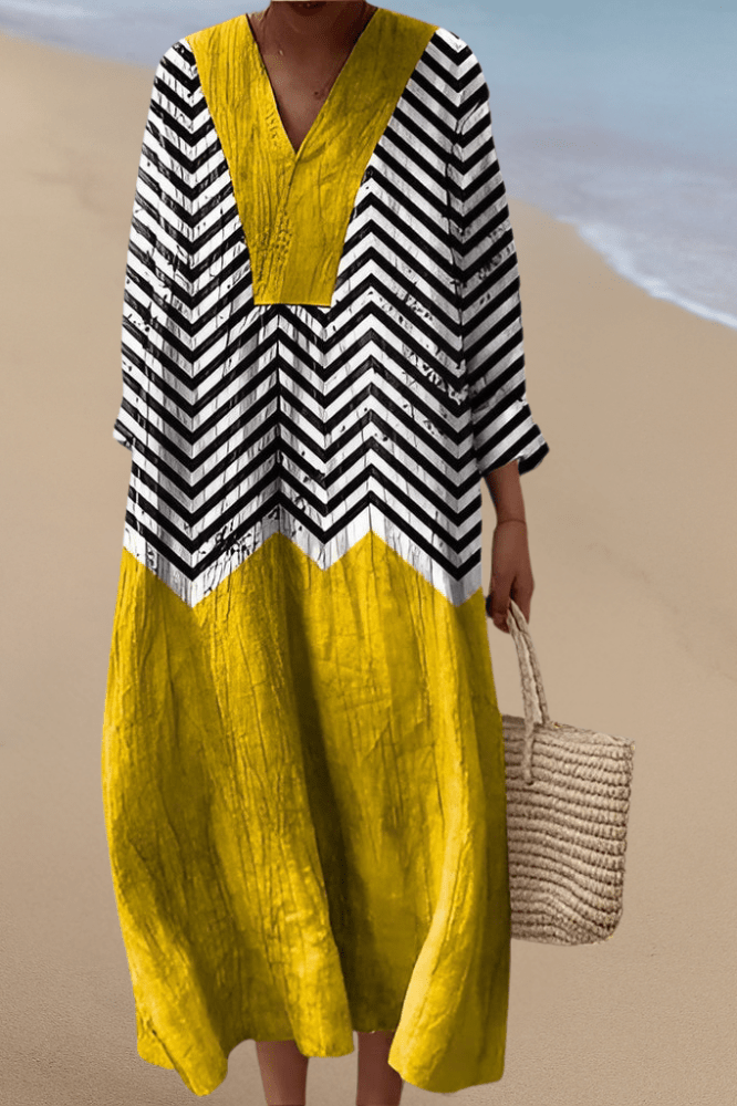 Women's vibrant zigzag V-neck summer dress, flowy geometric pattern, perfect for casual daywear. On sale!