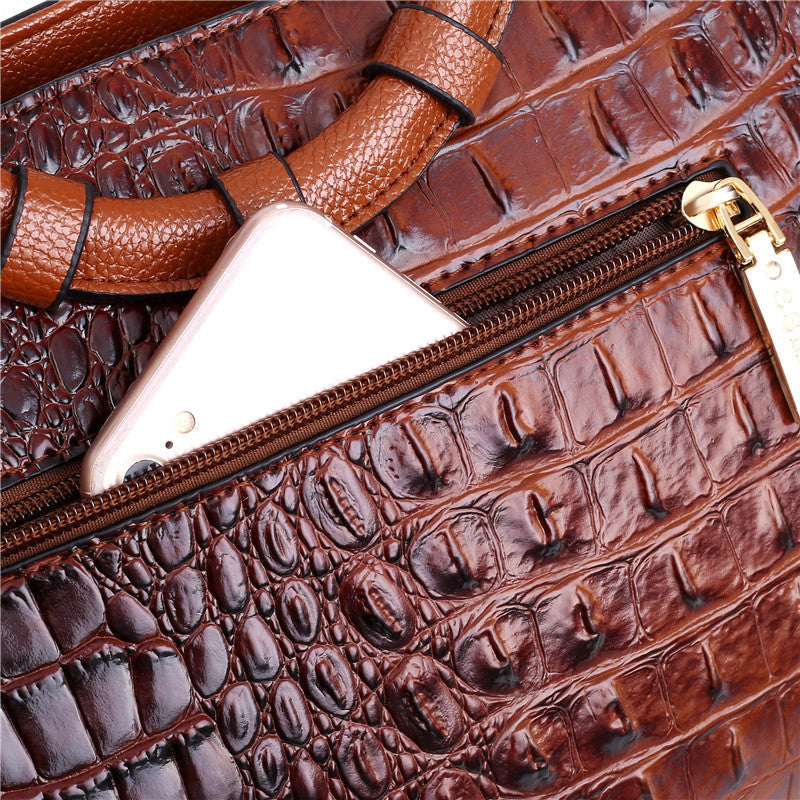 Timeless women's fashion accessory: vintage alligator-embossed bag with round handle.