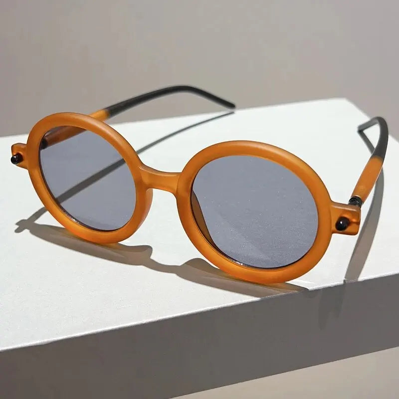 Chic women's circular shades, vintage style with complete UV400 eye protection.
