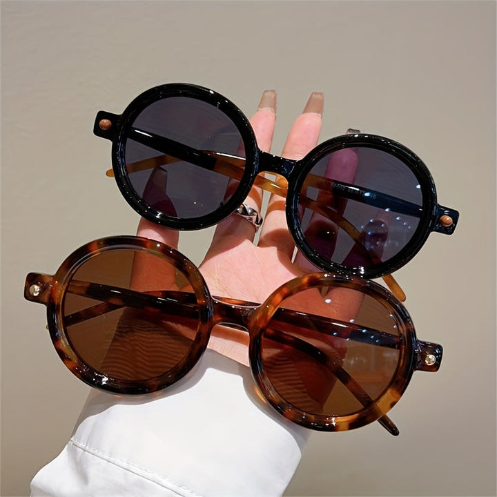 Retro women's circular shades, fashionable eyewear with UV400 protection.