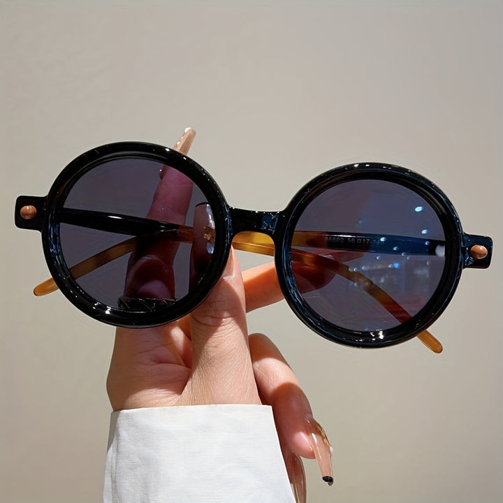 Women's acetate vintage circular sunglasses, chic UV400 shades for style.