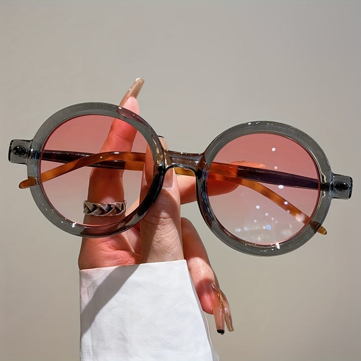 Classic vintage circular women's sunglasses, essential UV400 eyewear for sun.
