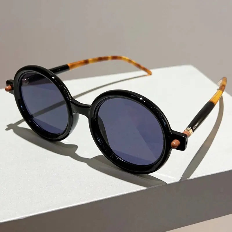 Women's fashion circular sunglasses, vintage look with UV400 protection.