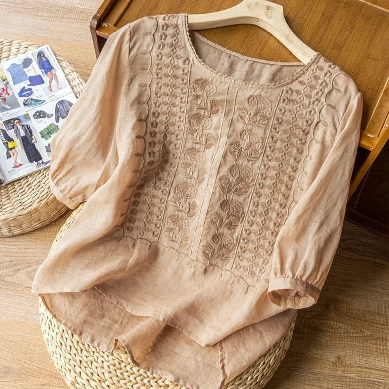 Versatile women's vintage embroidered blouse with three-quarter puff sleeves, great for casual chic or elegant wear.