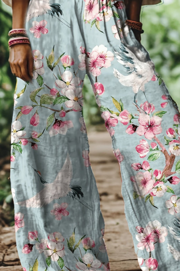 Close-up of vintage floral print detail on women's relaxed fit cropped pants, perfect for summer.