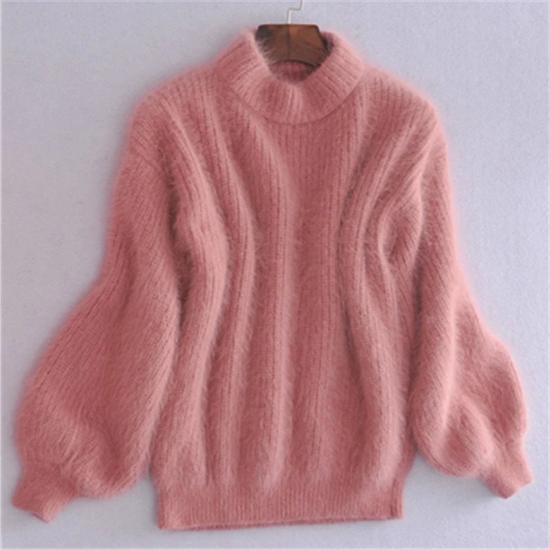 Women's solid color loose knit sweater, showing the flattering drape and vintage style.