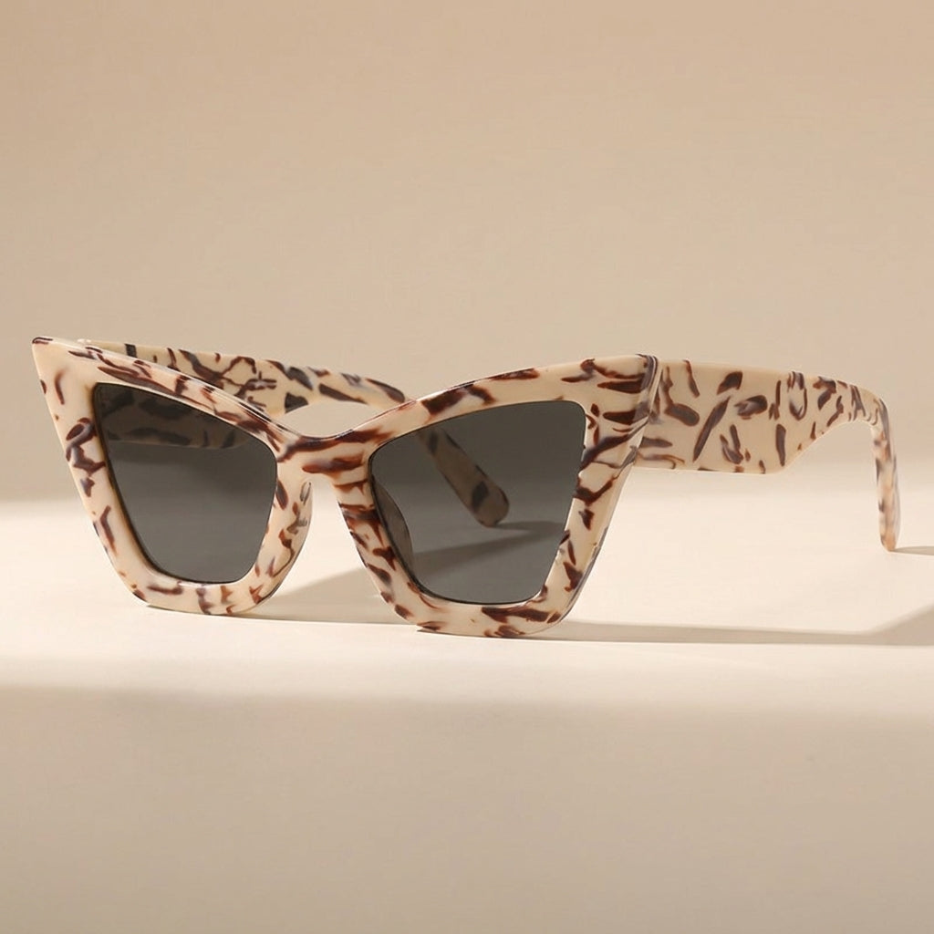 Leopard print vintage cat eye oversized sunglasses for women. Stylish UV400 fashion accessory.